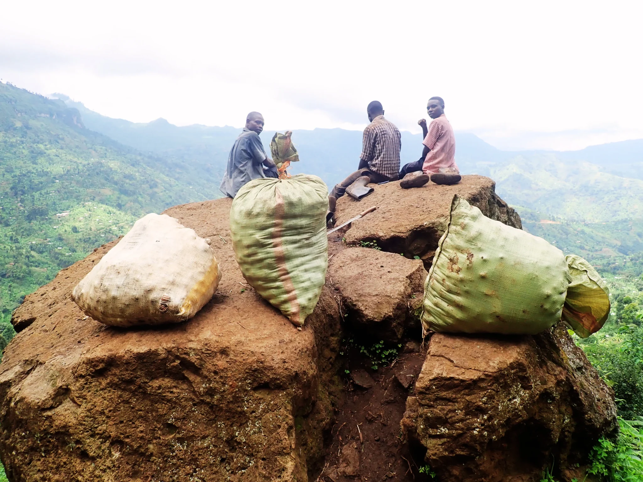 Community member carrying potatoes